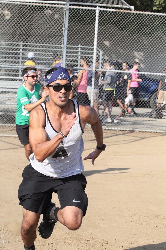 Ralph Sansano bolts to first base.